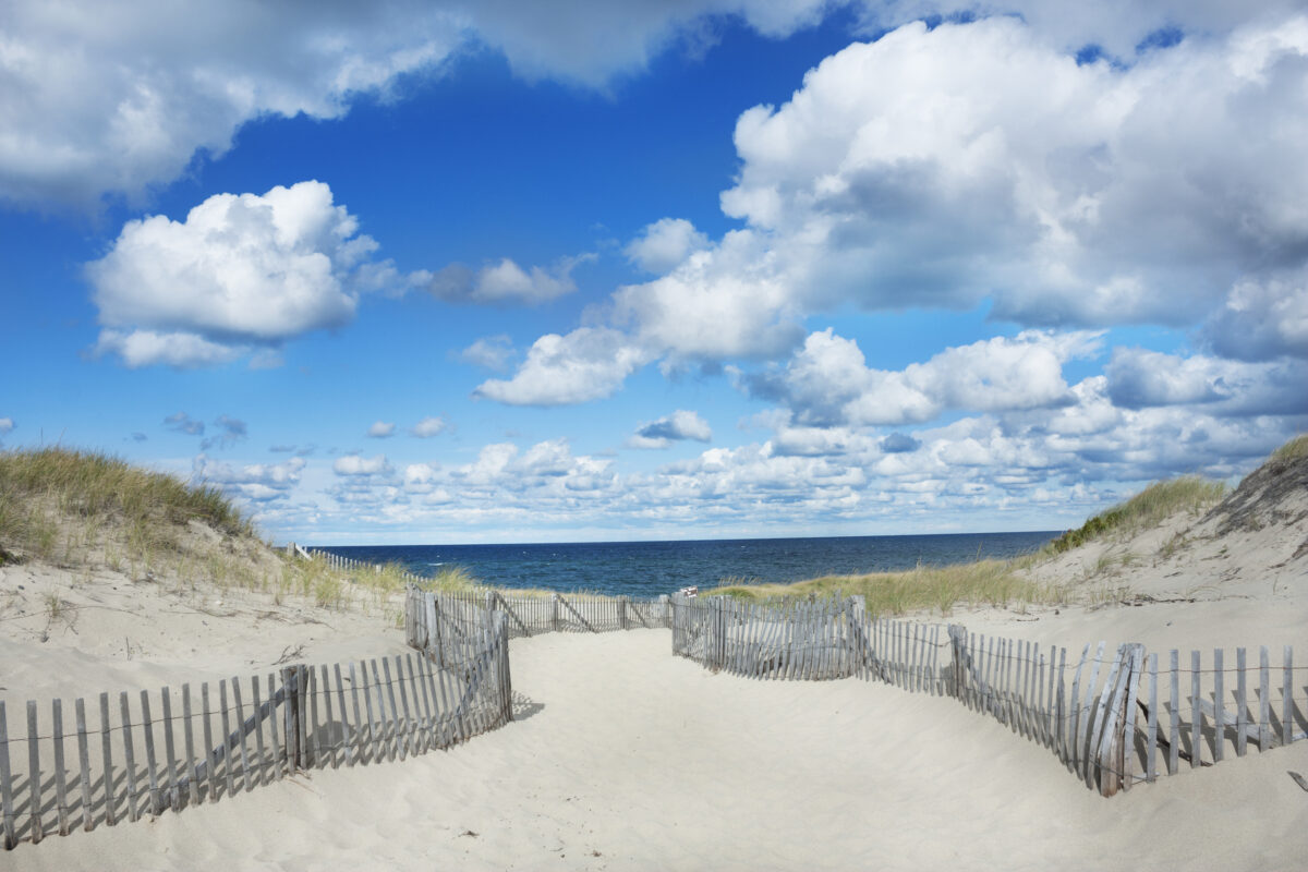 Big sky with huge clouds and beautiful beach at Race Point Beach, Provincetown Massachusetts.