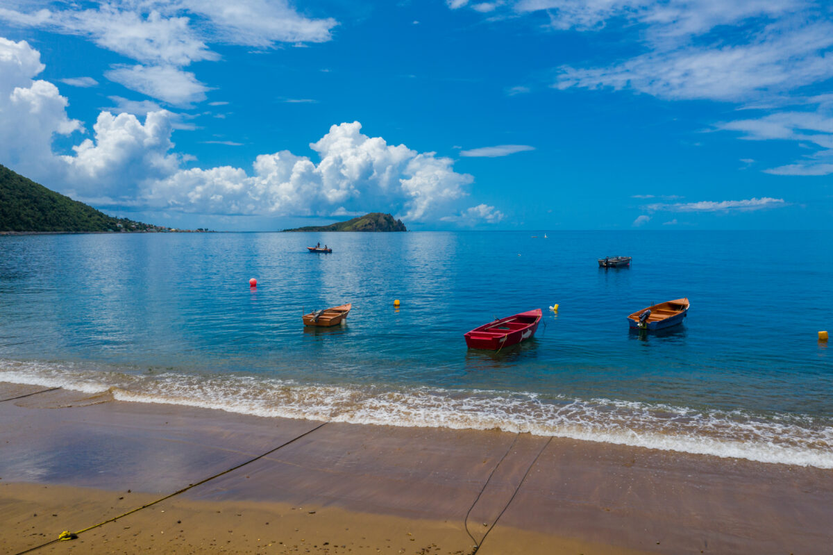 boats in the water at Soufriere Beach, Dominica
