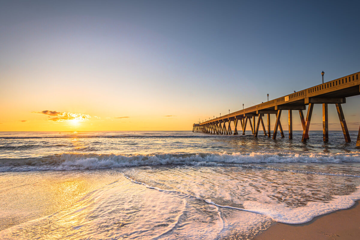 Johnnie Mercers Fishing Pier at sunrise in Wrightsville Beach east of Wilmington, North Carolina, United States.