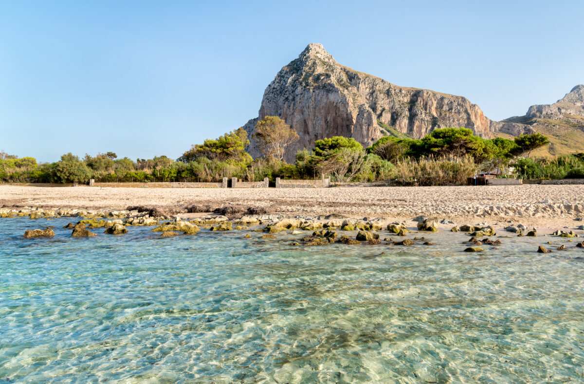 View of San Vito Lo Capo beach with Monte Monaco in background, Sicily, Italy.