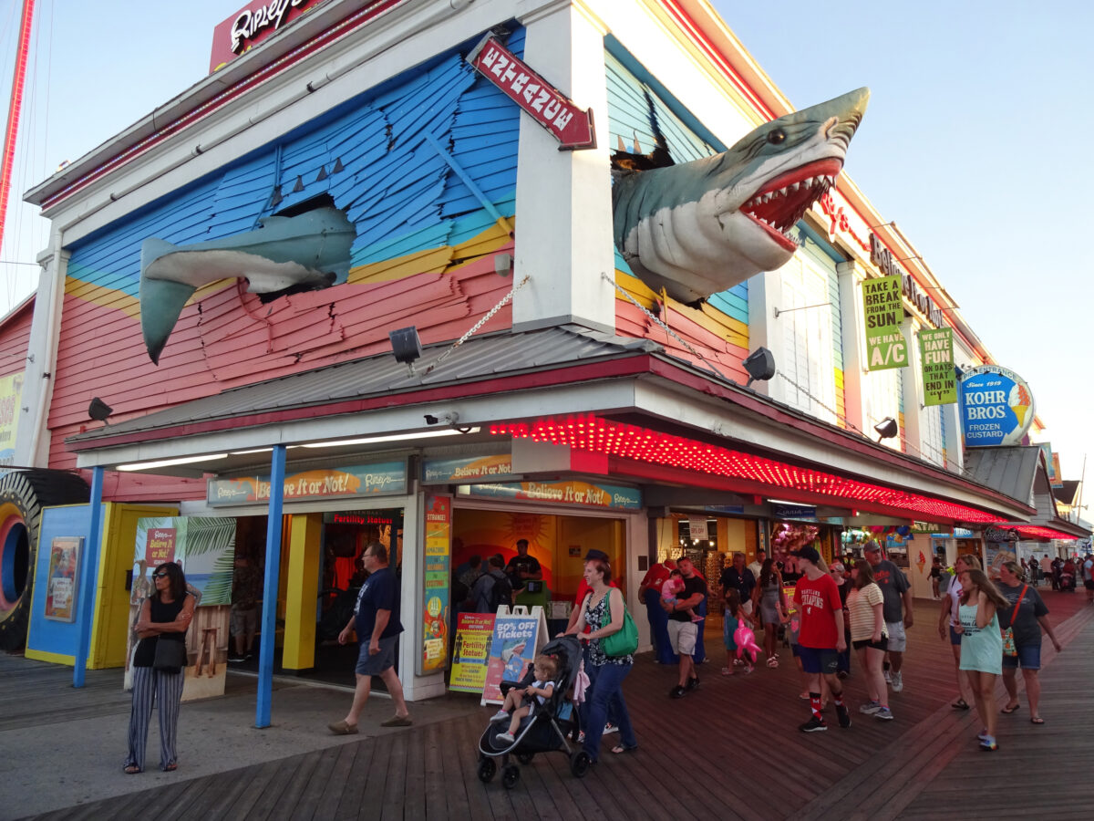 Busy Boardwalk in Ocean City Maryland at Dusk in Summer.