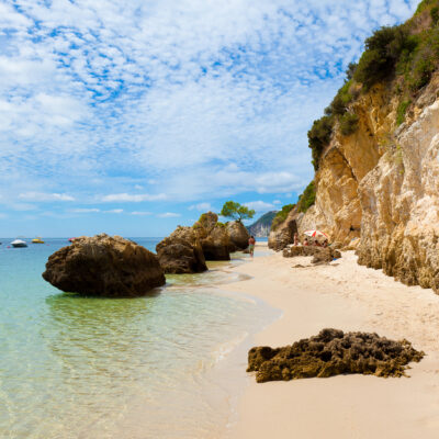 This Charming Beach Town in Portugal Has Dolphin Cruises, National Park Beaches, and Legendary Fried Seafood