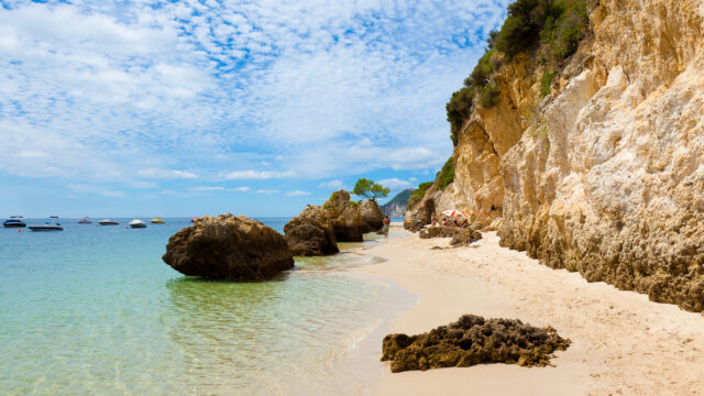 This Charming Beach Town in Portugal Has Dolphin Cruises, National Park Beaches, and Legendary Fried Seafood
