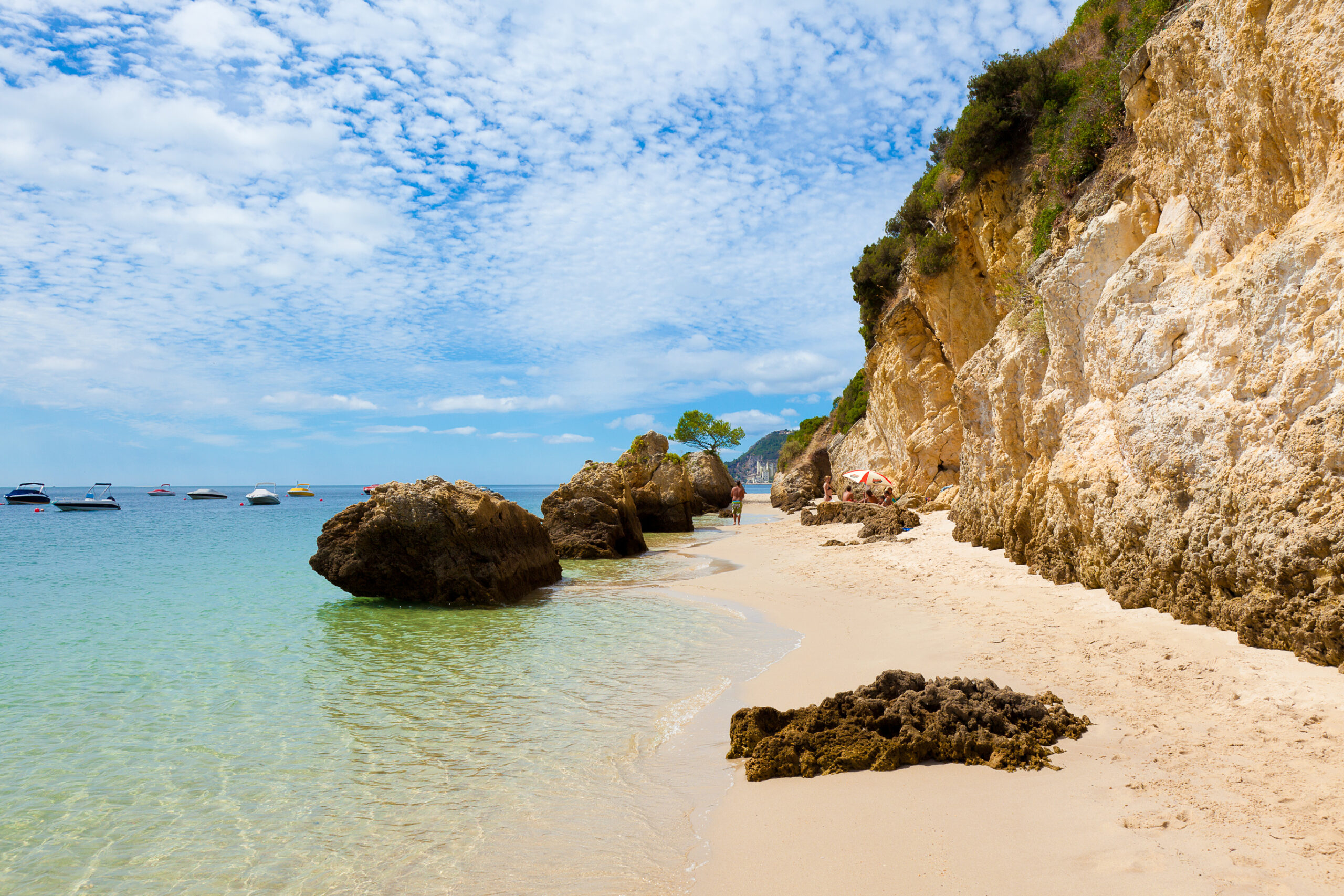 This Charming Beach Town in Portugal Has Dolphin Cruises, National Park Beaches, and Legendary Fried Seafood