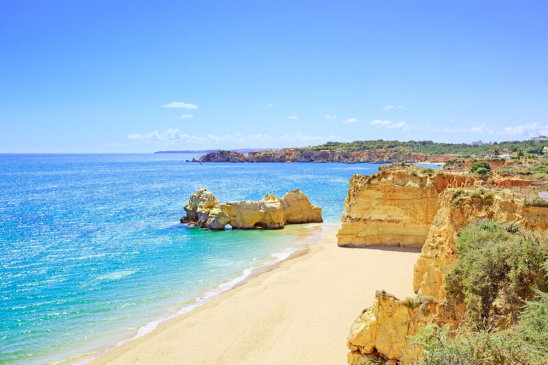 Beach and rock formation known as Praia da Rocha in travel destination Portimao. Algarve, Portugal, Europe.