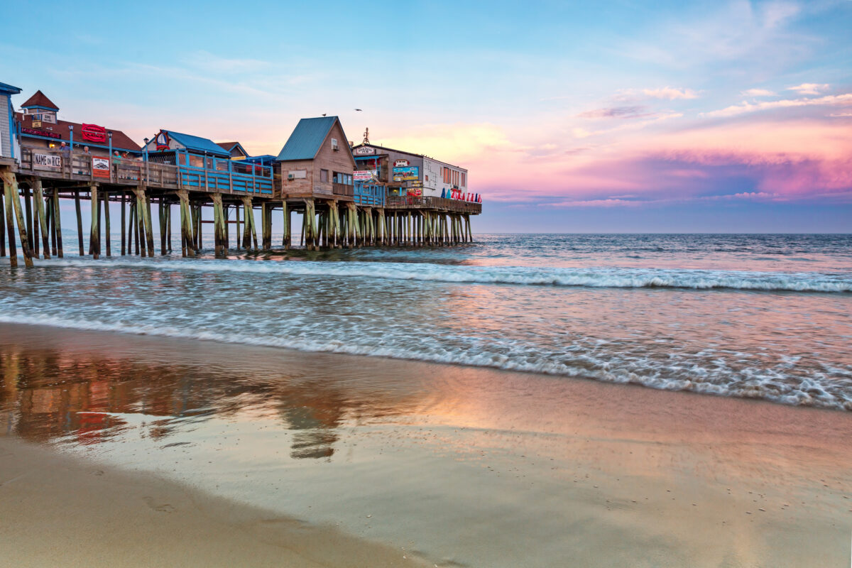 The busy pier of Old Orchard beach, Portland, Maine, at sunset