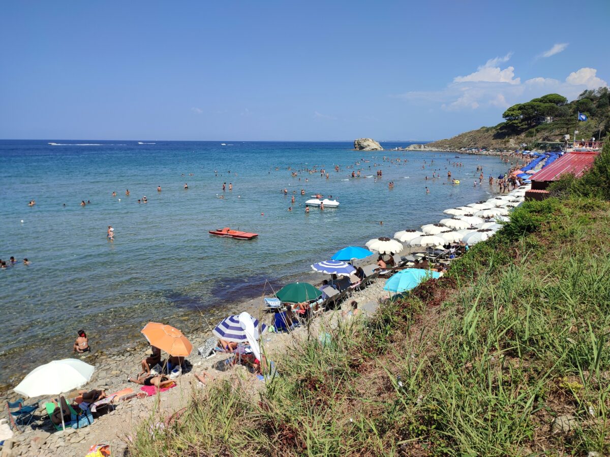 Tourists on spiaggia libera beach in Salerno, Campania, Italy