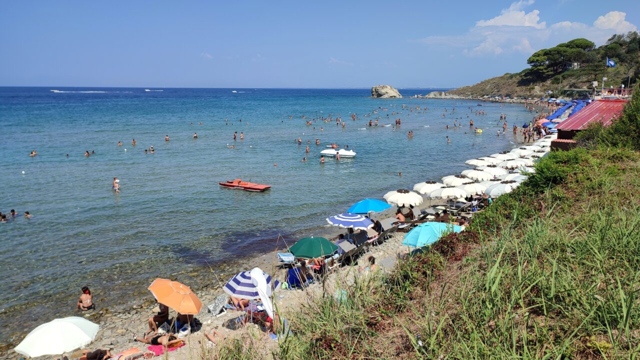 Tourists on spiaggia libera beach in Salerno, Campania, Italy