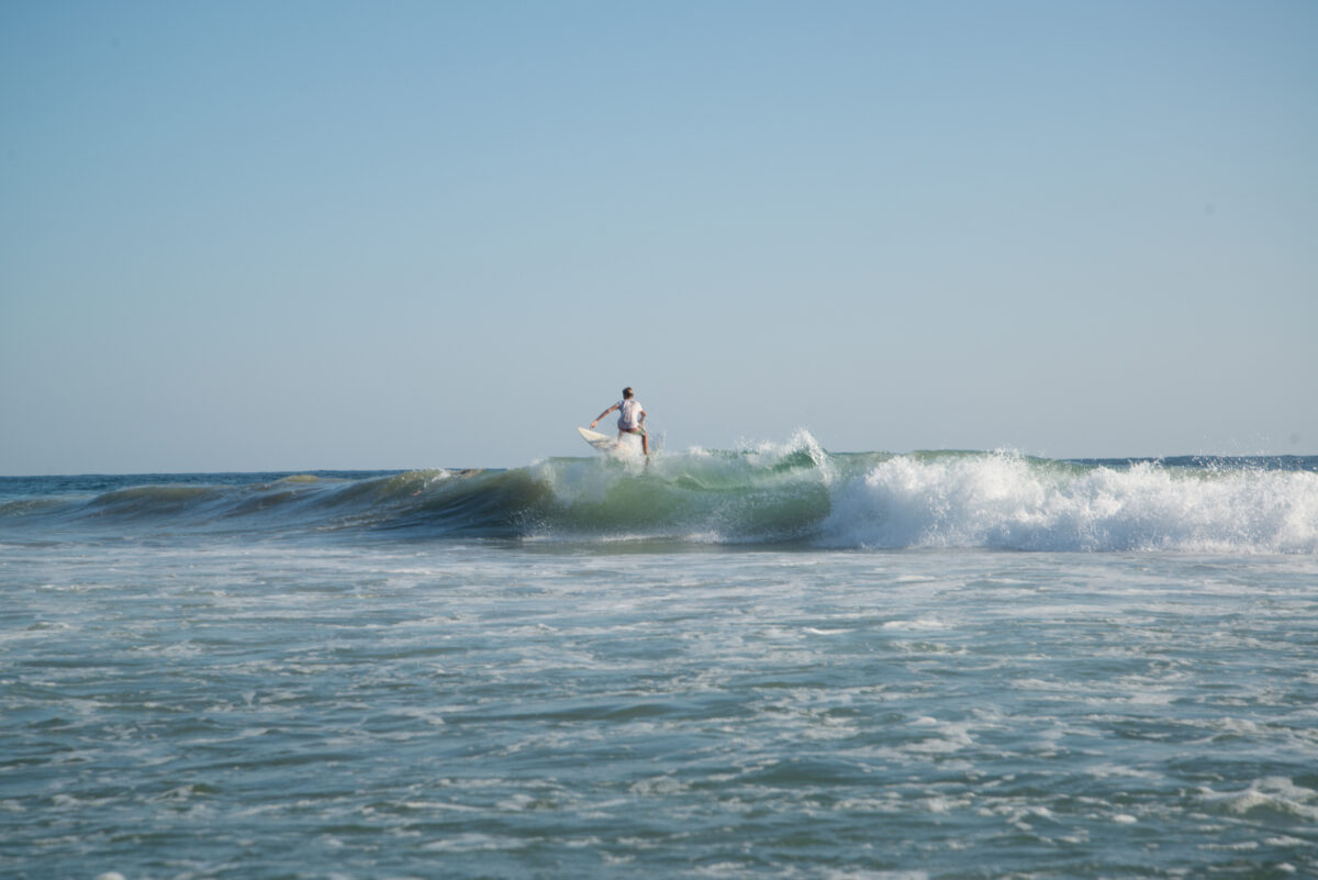 Surfer at Playa San Agustinillo in Oaxaca