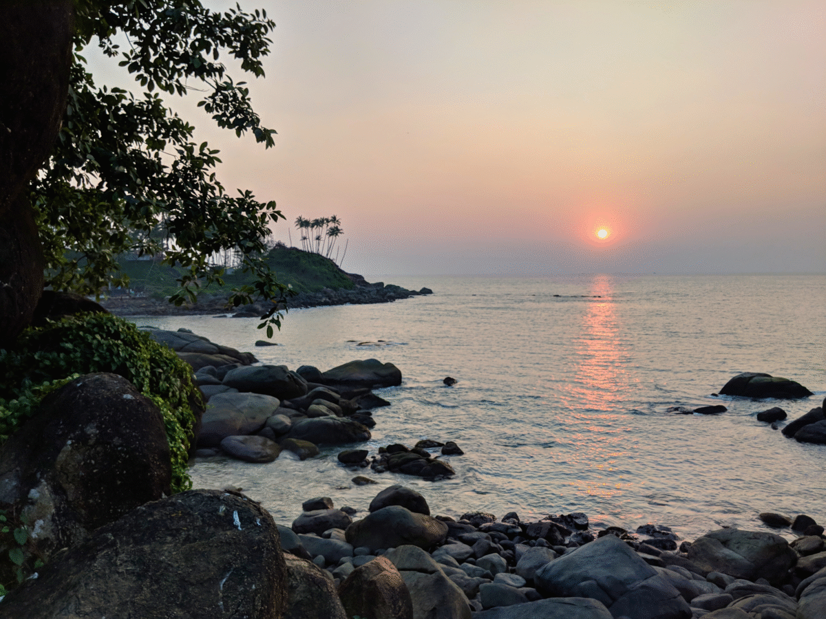 sunset over the water in Colomb Beach, India