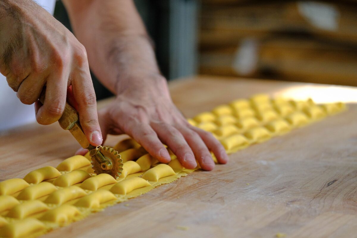 Man cuts out homemade pasta at Rocca in Tampa.