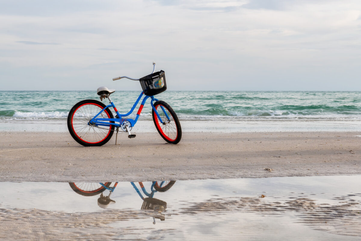 Bicycle on the beach at Sunset in Siesta Key, Florida.