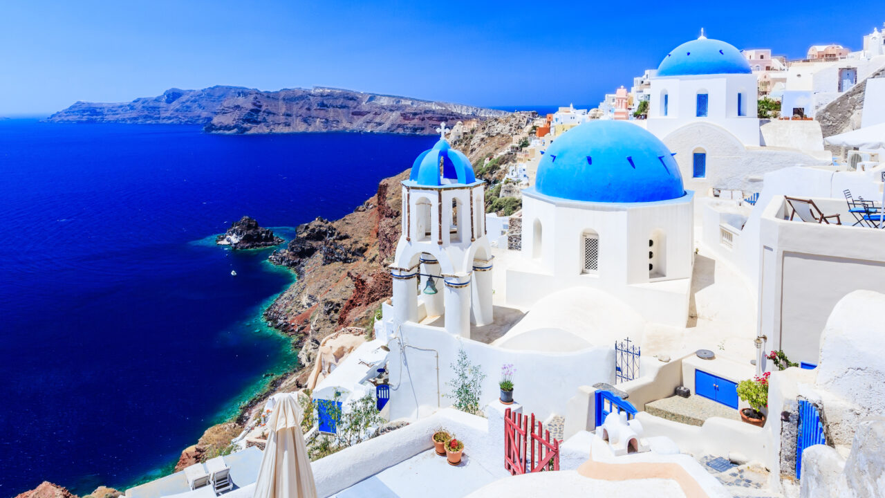 Blue dome church on the village of Oia