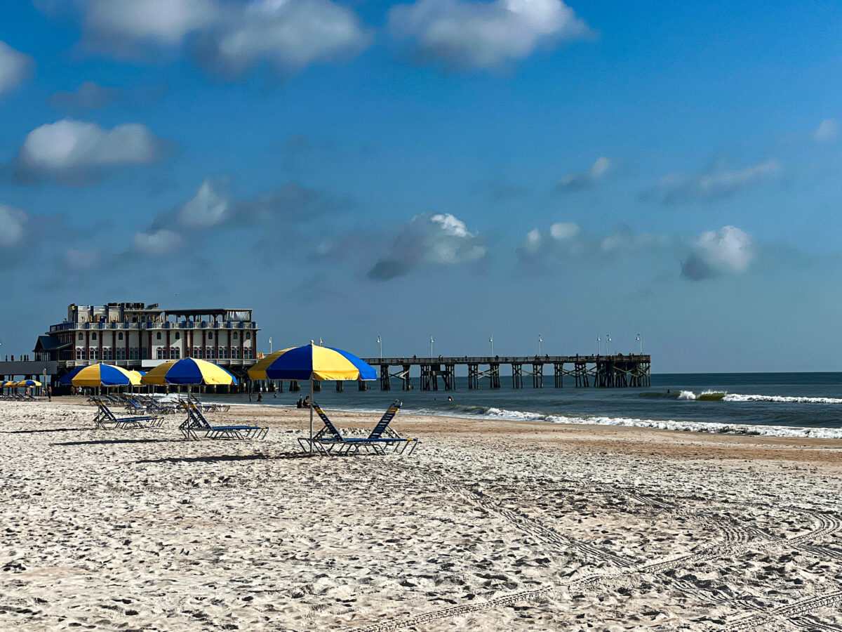 Pier and Beach Chairs With Umbrellas in Daytona Beach, FL