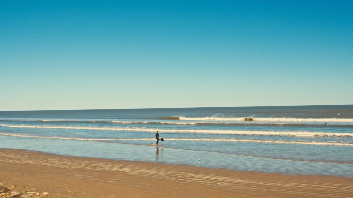 Surfer in Surfside Beach, Texas.