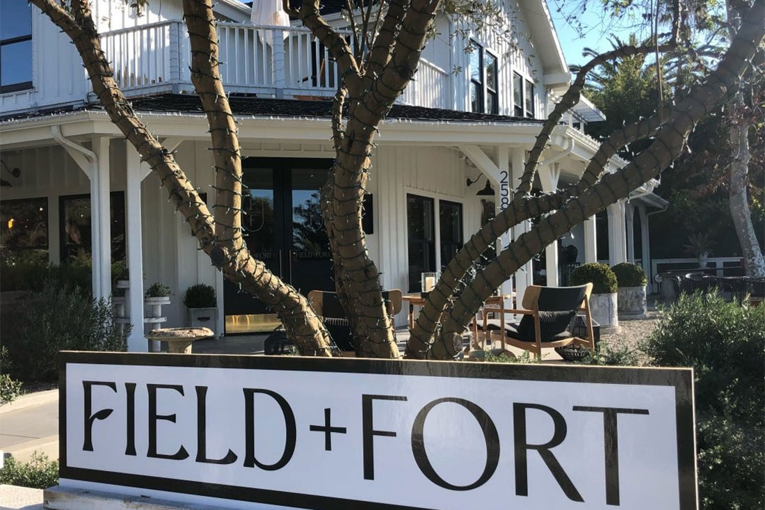 Field & Fort sign and backdrop of cafe
