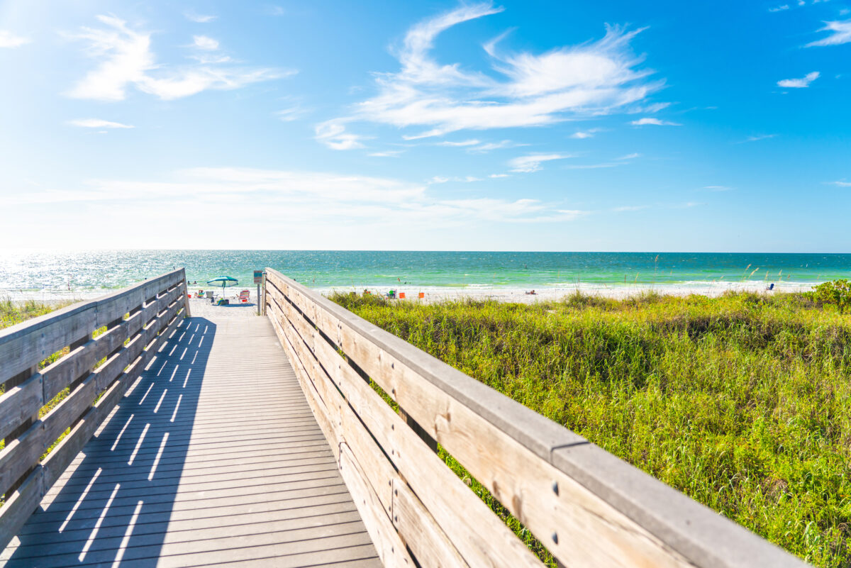 Wooden Boardwalk to Indian rocks beach in Florida, USA