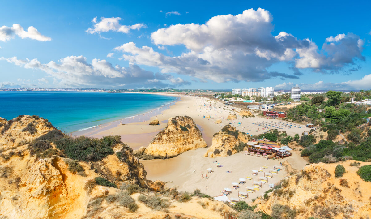 Landscape with Praia dos Tres Irmaos, famous beach in Algarve, Portugal