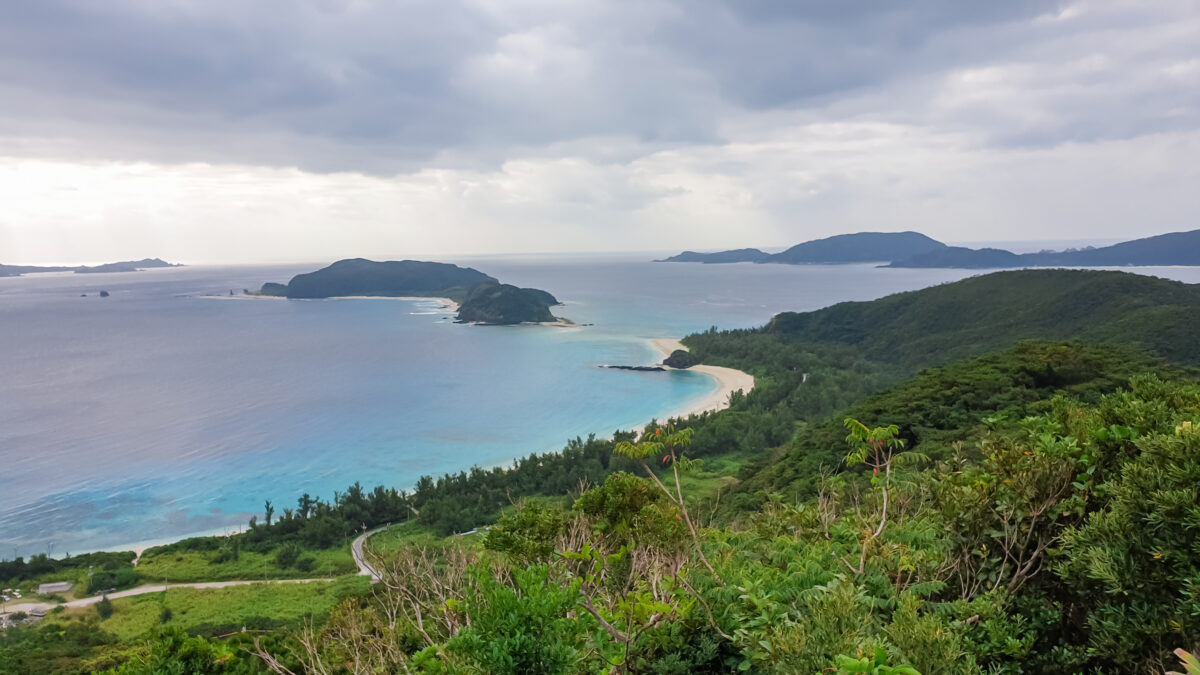 A breathtaking elevated view captures the stunning coastline of the Kerama Islands.