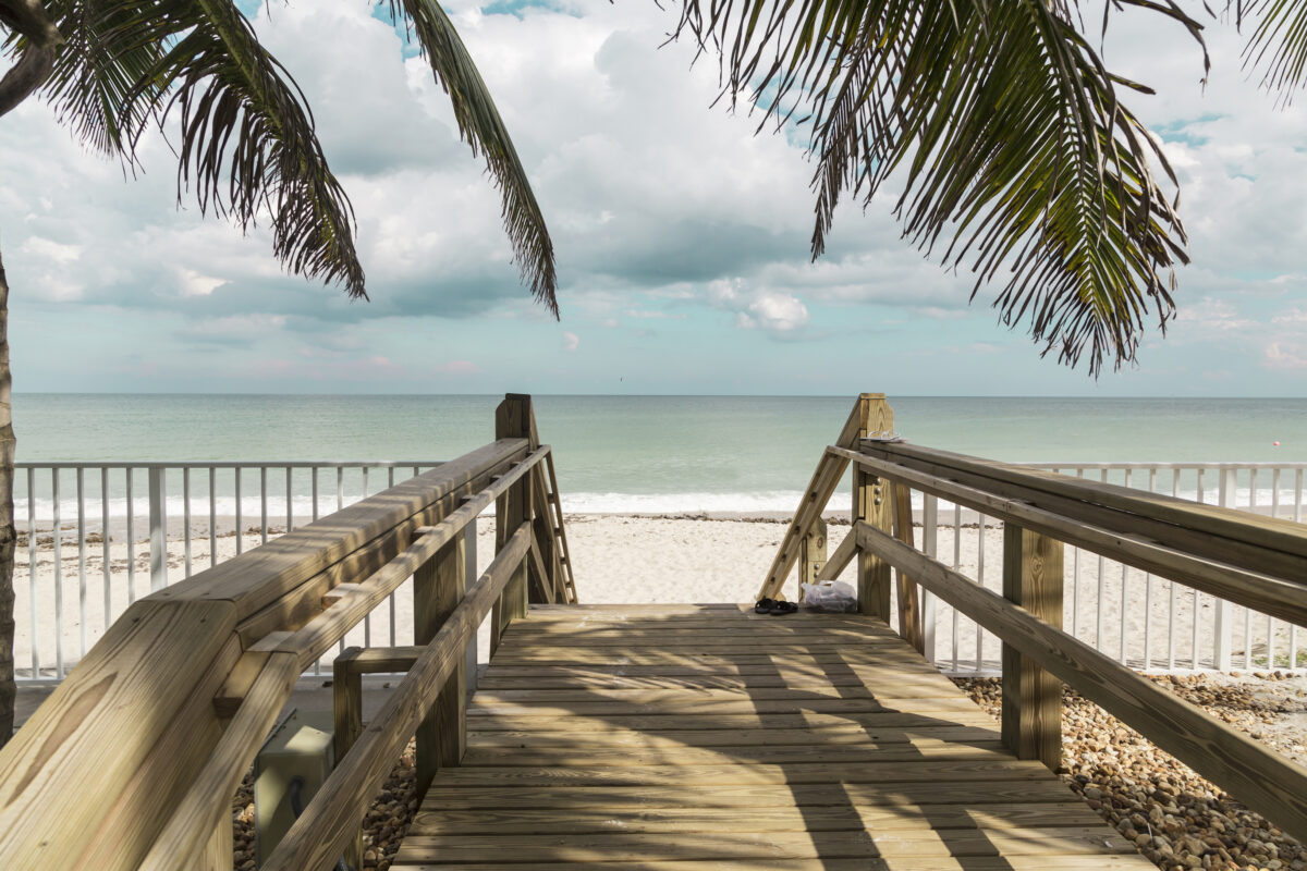 Wooden stairs on deserted beach dunes in Vero Beach, Florida.