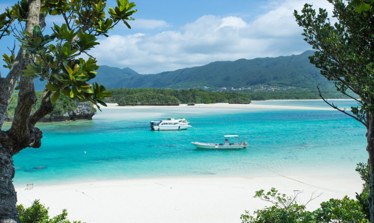 Beautiful tropical lagoon with a white sand beach and crystal clear turquoise water at Kabira Bay, Ishigaki island, Okinawa, Japan.