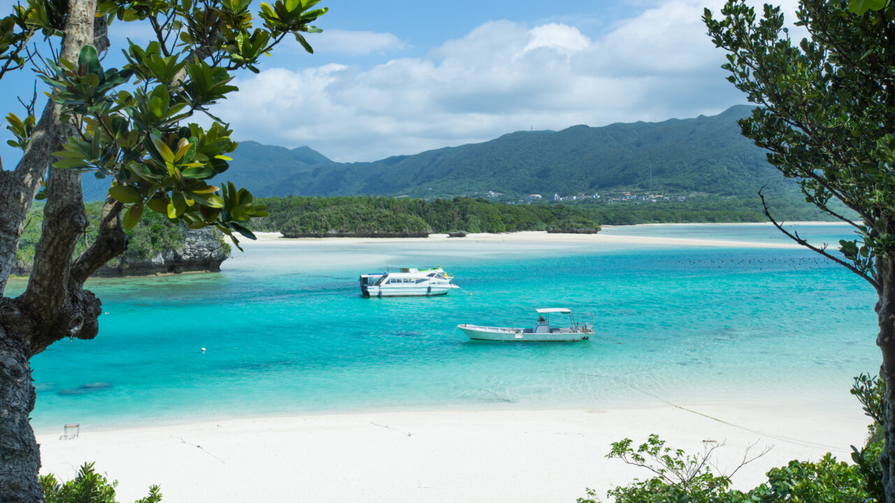 Beautiful tropical lagoon with a white sand beach and crystal clear turquoise water at Kabira Bay, Ishigaki island, Okinawa, Japan.
