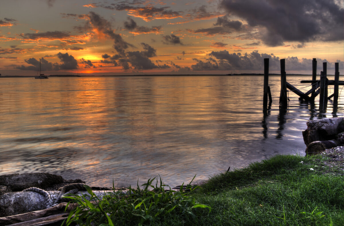 Sunset, clouds and harbor from the marina overlooking the St. Marys River at Fernandina Beach, Amelia Island Florida.