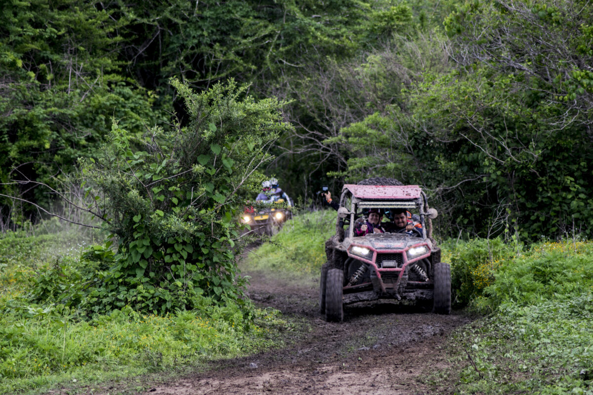Utv vehicle rzr running in the rally called the cafe route.