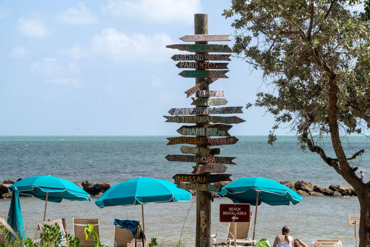 Colorful directional markers by beach, Fort Zachary Taylor State Park, Key West Florida.