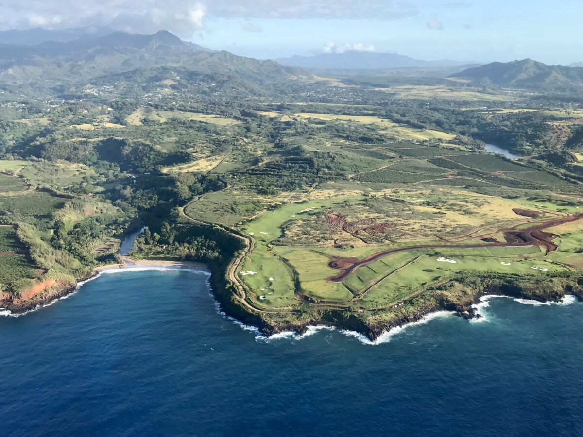Poipu coast and beach from above on flightseeing excursion.