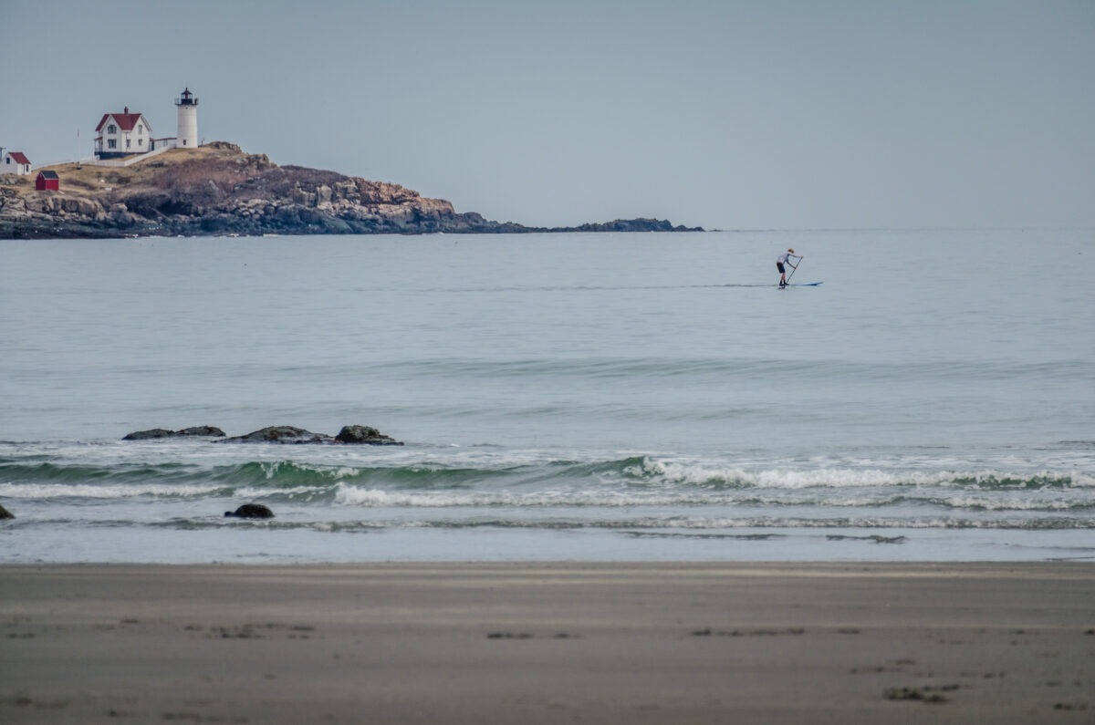 View of Nubble Lighthouse in Cape Neddick in York Maine along the Atlantic Ocean.