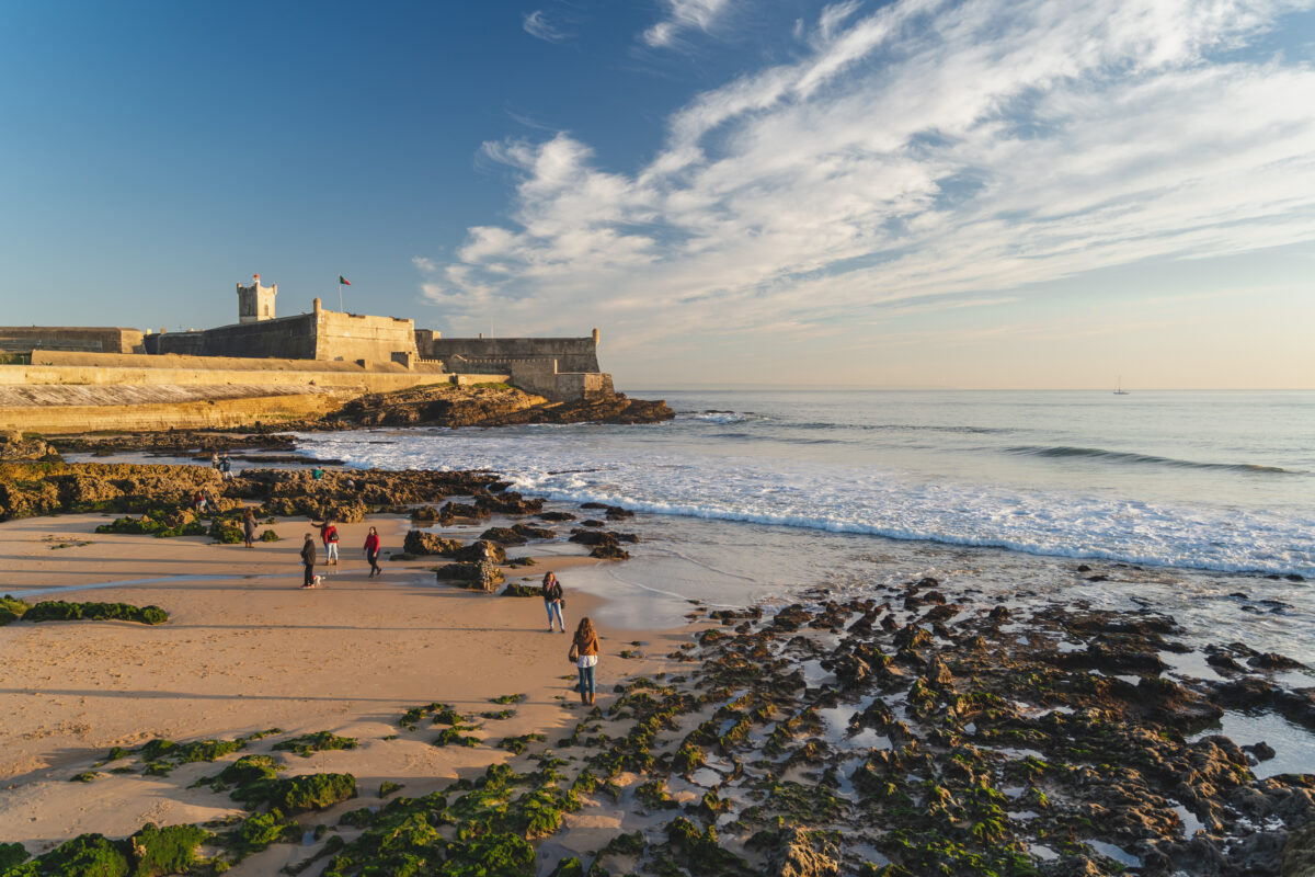 Praia de Carcavelos view of Saint Julian Fortress with lighthouse tower.