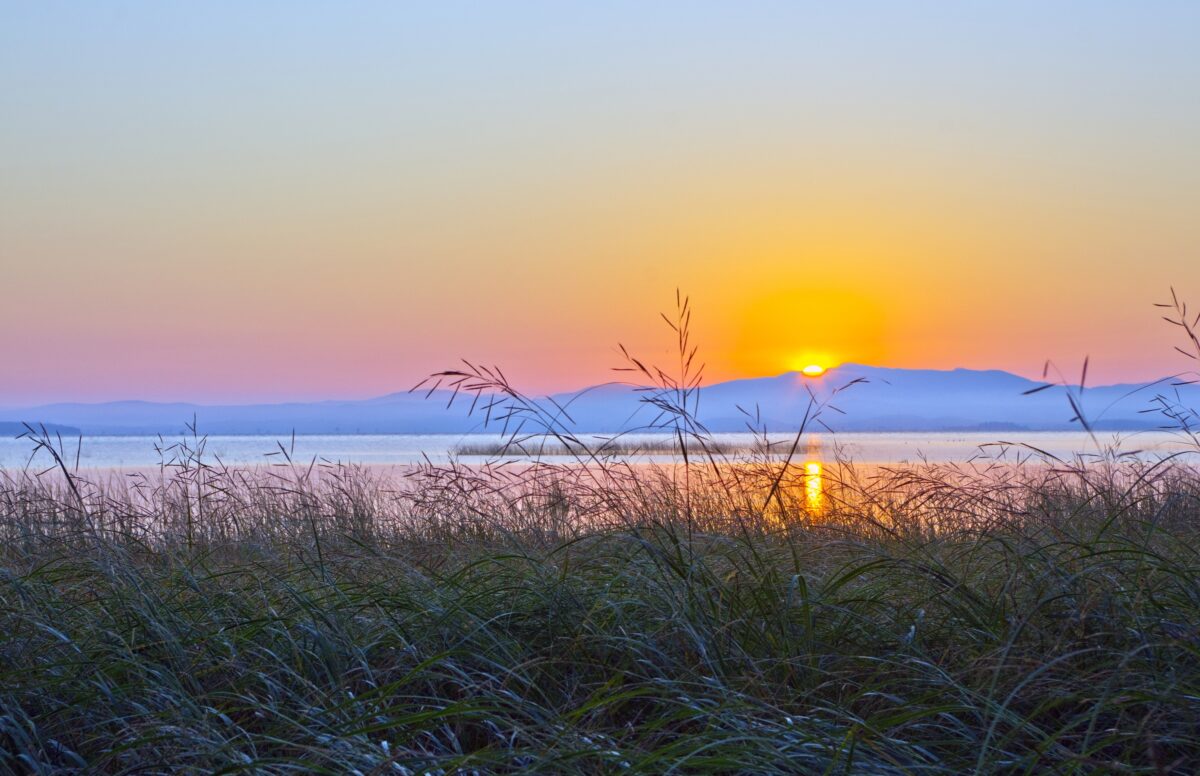 Sunrise at AuSable Point looking across Lake Champlain toward Vermont.