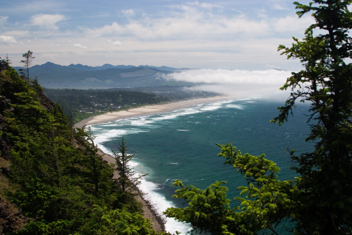 Manzanita, Oregon is seen from Highway 101 over Neahkahnie Mountain above the Pacific Ocean