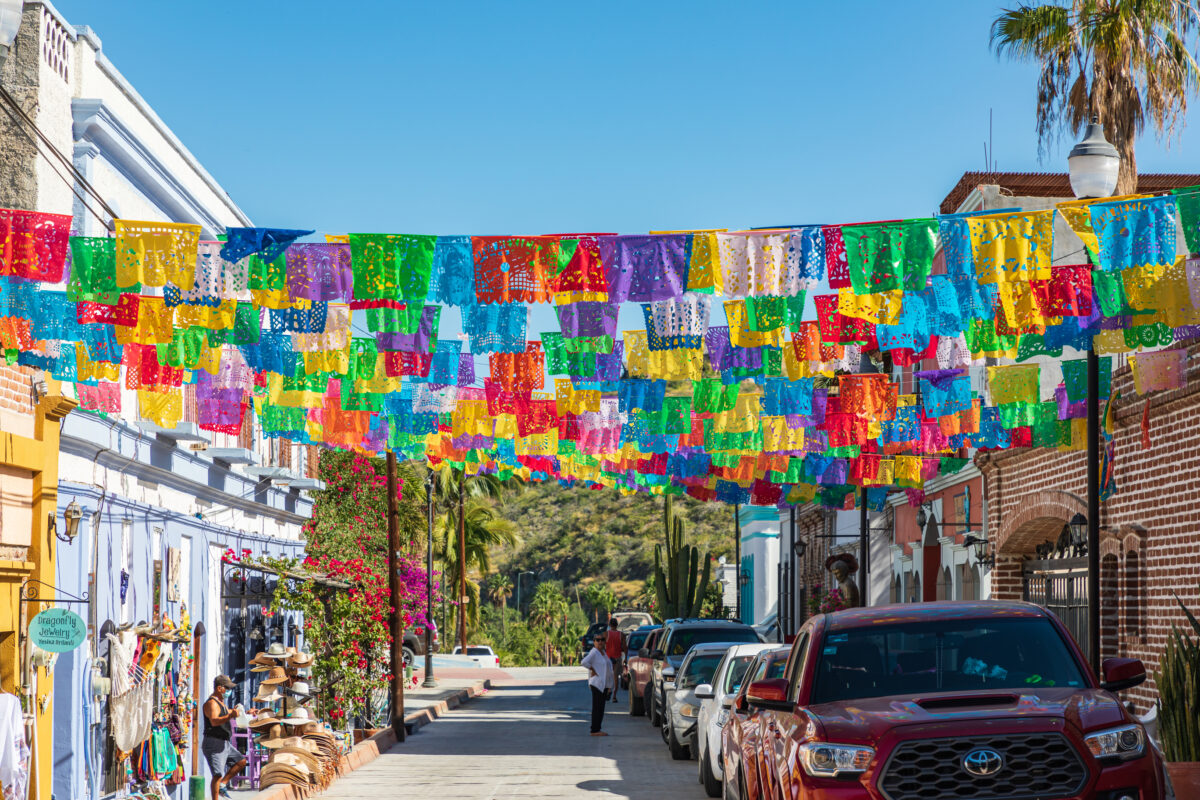 Colorful banners over a street in Todos Santos