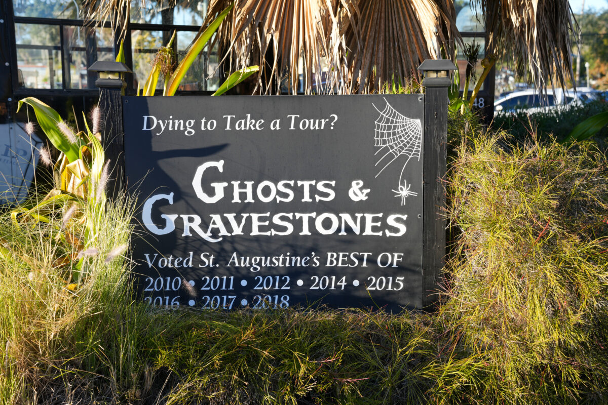 Sign advertising the Ghosts and Gravestones for tourists, St. Augustine, Florida.