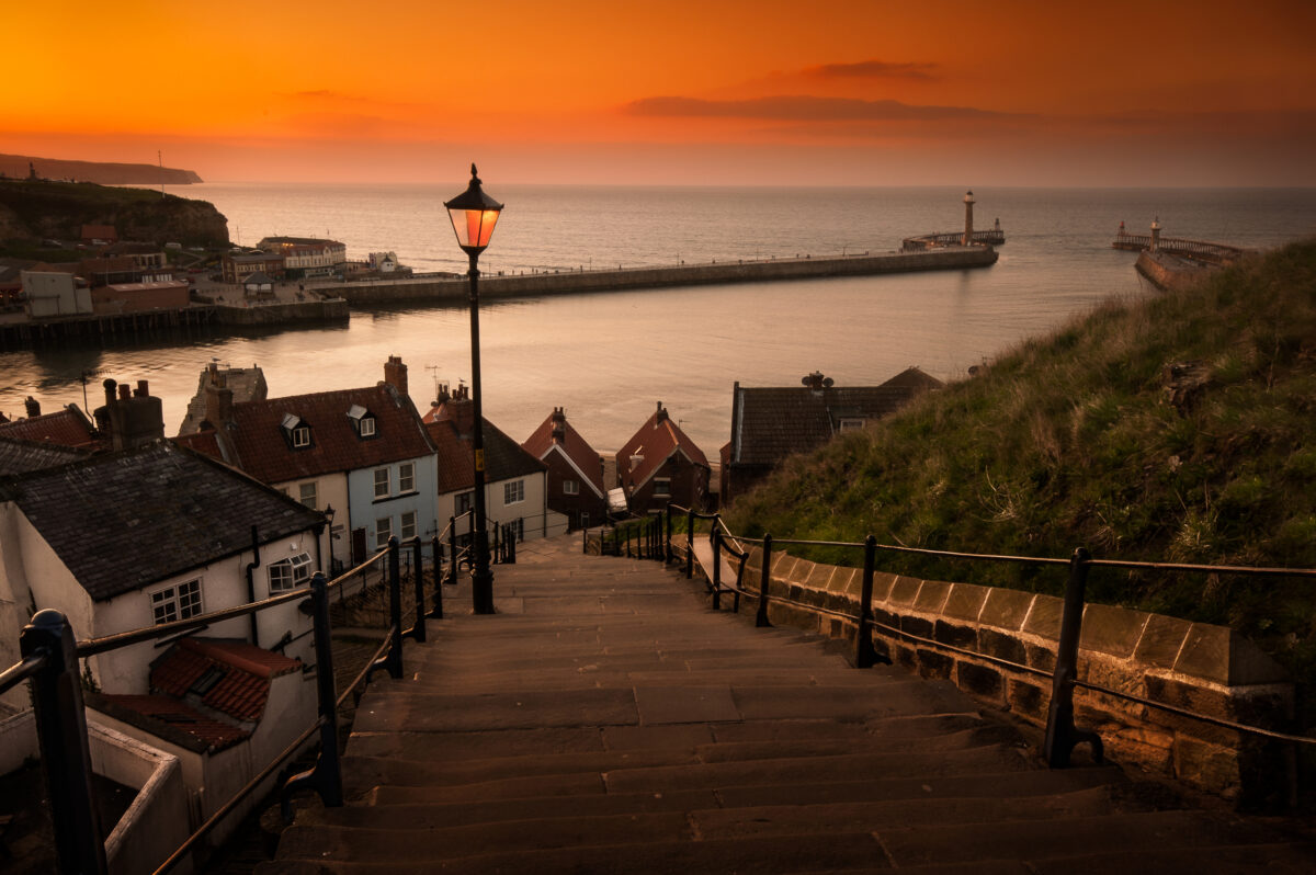 Whitby Steps at Sunset. Sunsets over the famous harbour of Whitby, Landing place of Dracula.