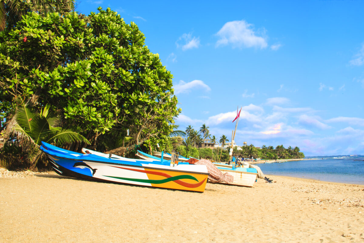 boats on the tropical beach of Bentota, Sri Lanka