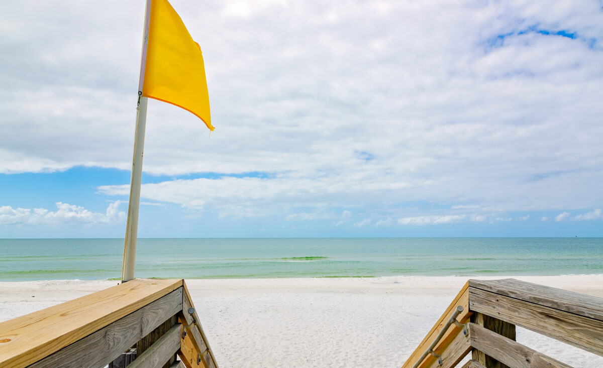 Yellow flag on beach in St. Joseph Peninsula State Park in Port St. Joe Florida