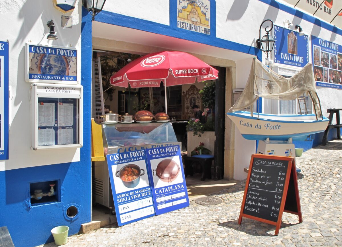 Casa da Fonte restaurant entrance with boat decor in Albufeira
