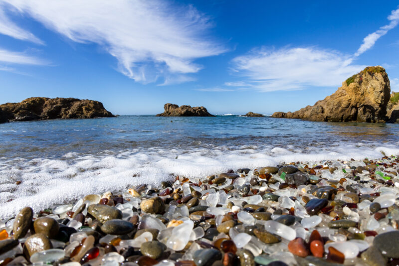 Colorful glass pebbles blanket this beach in Fort Bragg, the beach was used as a garbage dump years ago, nature has tumbled the glass and polished it making it a tourist destination
