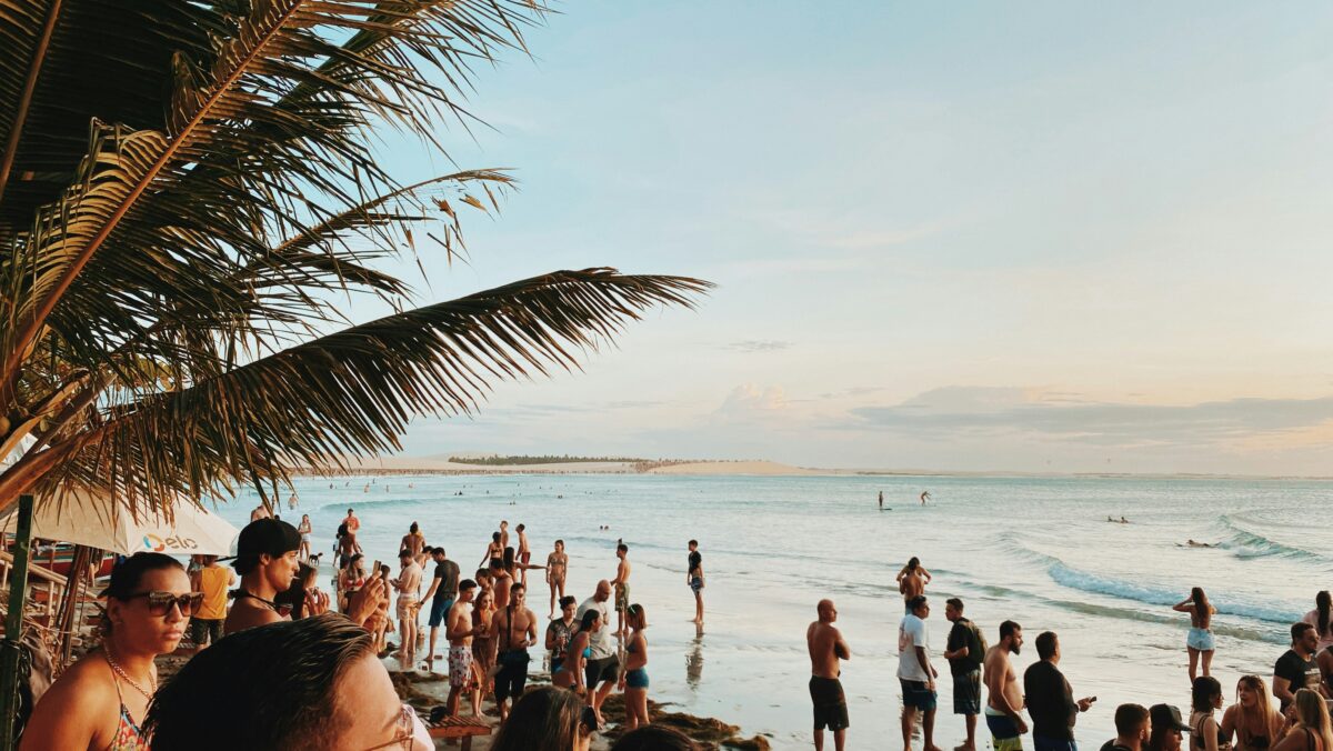 people standing on the shoreline of Jericoacara, Brazil
