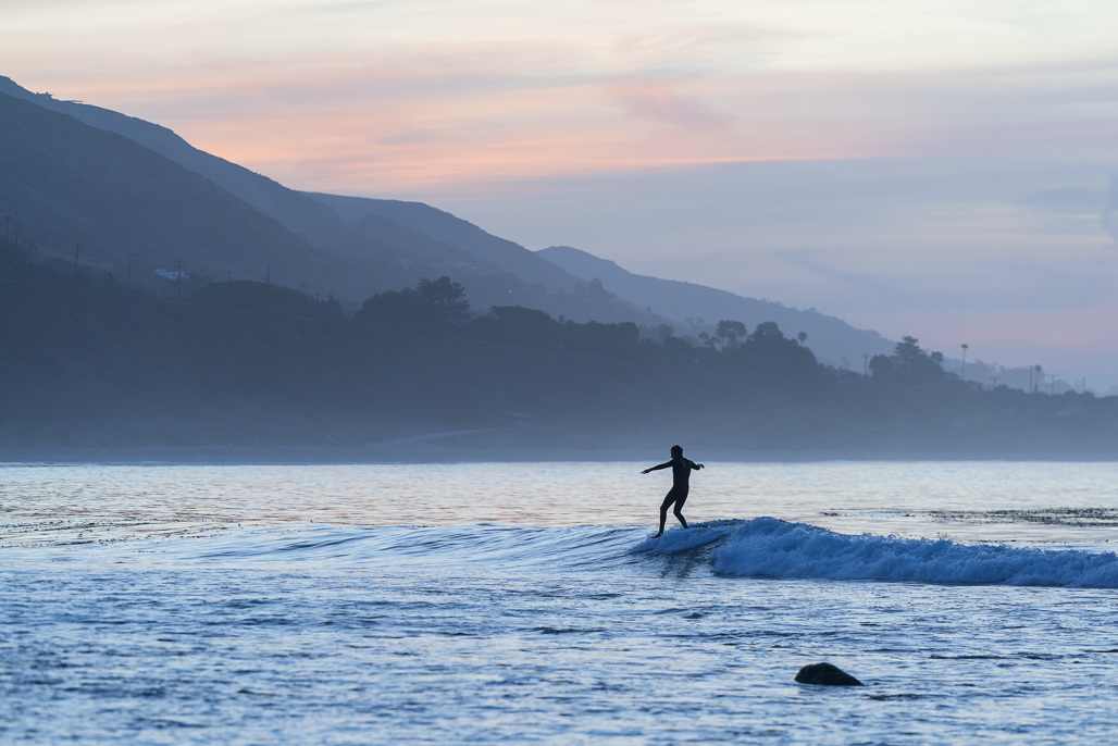 surfer catching a wave at Leo Carrillo State Park