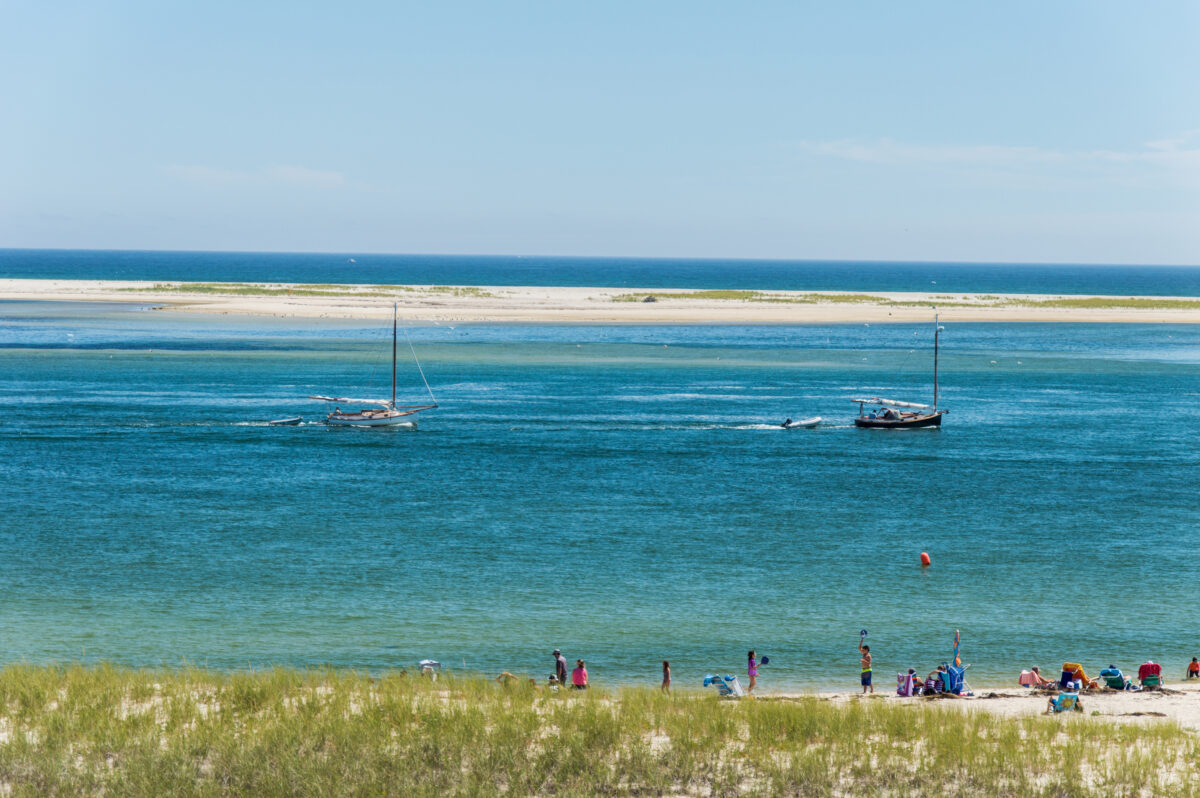 Boat sailing along the The Chatham Lighthouse Channel, in Cape Cod Massachusetts, USA