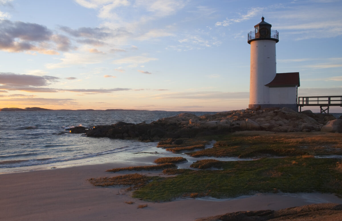 Beautiful Annisquam Lighthouse in Massachusetts at sunset with sky and clouds