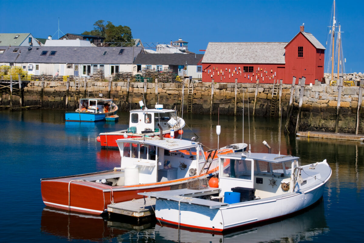 Scenic view of lobster boats moored at a harbor in Rockport, Massachusetts