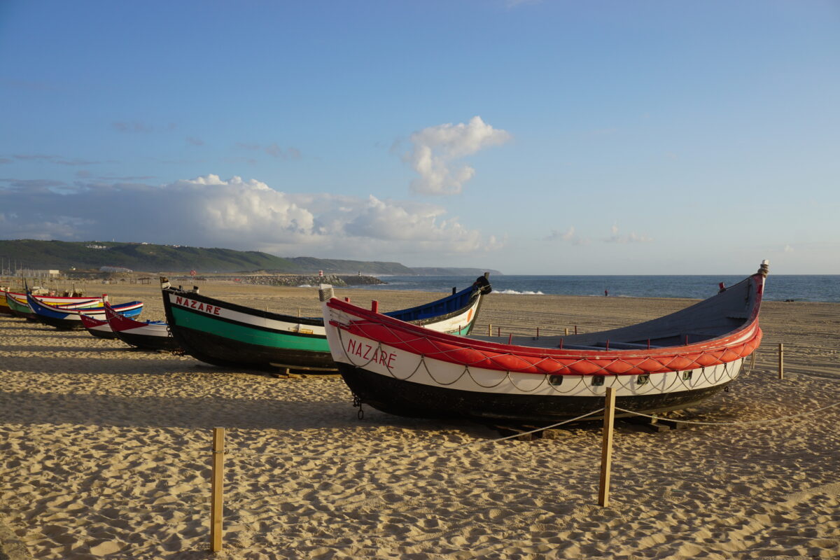 Boats on the beach in the seaside resort city of Nazare in the Silver Coast (Costa de Prata) in central Portugal