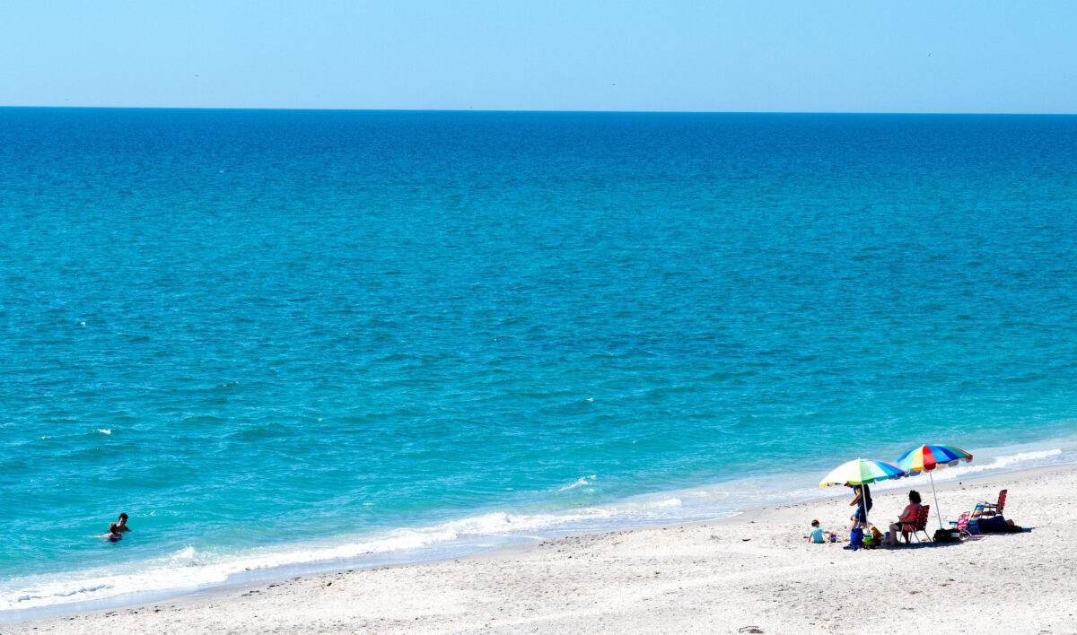 umbrellas on beach with blue water_Englewood Beach_Florida_Brandy Jo Hastings_