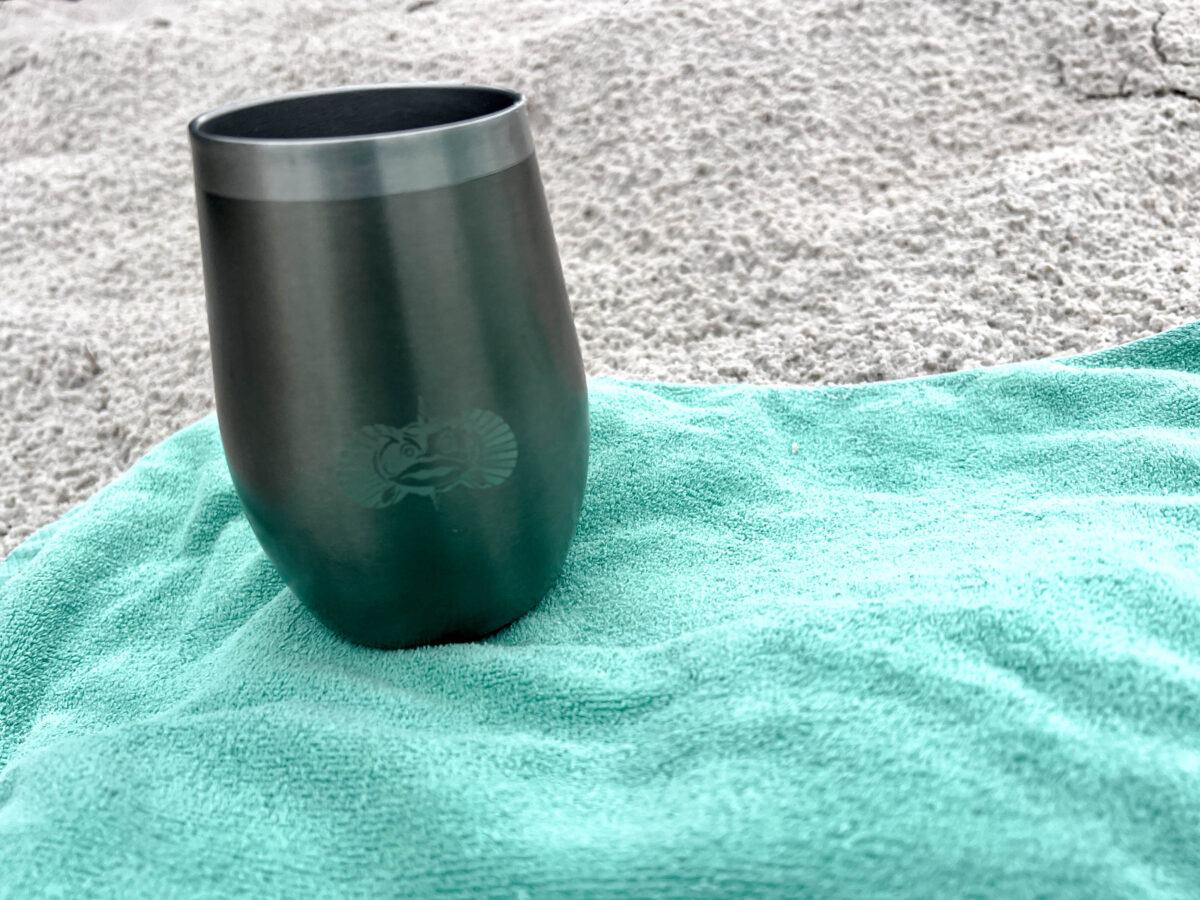 Toadfish metal cup on beach towel in sand_Brandy Jo Hastings_