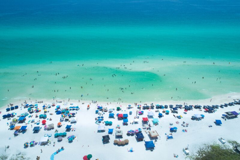 Overhead the Surf and Sand at a Beautiful World-Famous 30A Florida Beach. This aerial photo depicts the incredibly beautiful surf sand and of course beachgoers at Santa Rosa Beach Florida one of the many incredible beaches which can be found along world-famous County Road 30A
